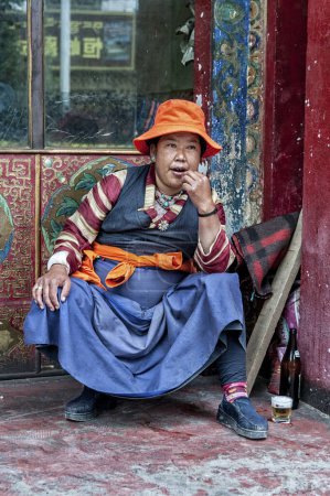 Photo for SHIGATSE, TIBET, CHINA - AUGUST, 21 2018: Unidentified Tibetan pilgrim in Shalu Monastery, Shigatse Prefecture, Tibet, China - Royalty Free Image