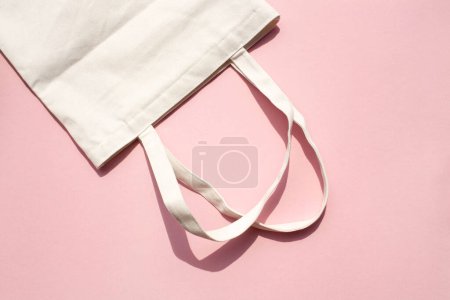 Photo for Linen natural grocery bag on a pink background. Zero waste - Royalty Free Image