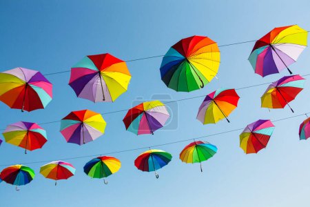 Photo for Multi-colored umbrellas on the blue sky background. Colorful autumn concept - Royalty Free Image