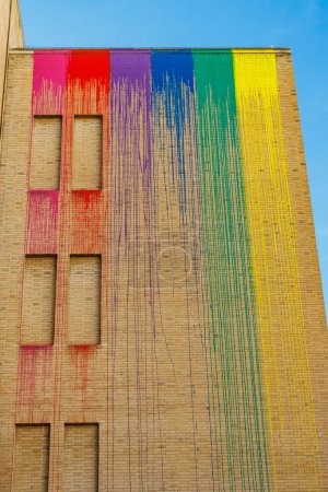 Building with rainbow colors and a blue sky in Barcelona, Catalonia, Spain, Europe