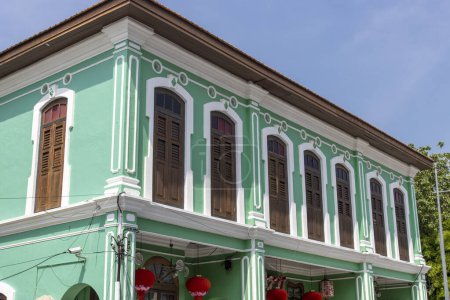 Green colored colonial building at the Lebuh Pantai street in George Town, Penang, Malaysia, Asia