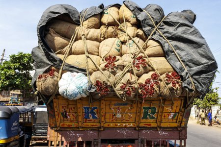 Photo for Bags with red peppers on a truck on the road in Karnataka, India, Asia - Royalty Free Image
