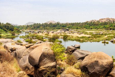 View at the Hampi landscape with big rocks and the Tungabhadra River, Hampi, Karnataka, India, Asia