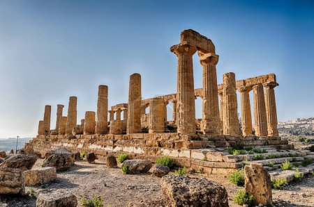 The ancient ruins of the Temple of Juno is illuminated by the sunlight in the late afternoon at the Valley Of The Temples near Agrigento on Sicily.