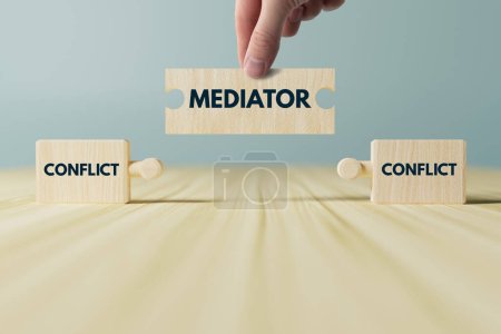 Photo for Wooden blocks, puzzles with the word conflict and a mediator that connects them. The concept of mediation, helping to resolve disputes, conflicts. - Royalty Free Image