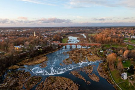 Photo for Venta Rapid waterfall, the widest waterfall in Europe and long brick bridge, Kuldiga, Latvia - Royalty Free Image