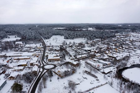 Photo for A panoramic view from above of the small Latvian town of Kandava on a snowy winter day - Royalty Free Image