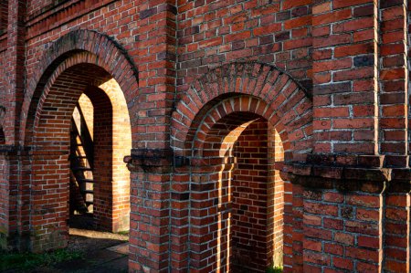 Téléchargez les photos : Old Catholic Church red brick gates in city Akniste, Latvia. Close-up, selective focus - en image libre de droit