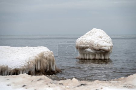 Frozen ice blocks in Baltic sea water on the shore, Kaltene, Latvia