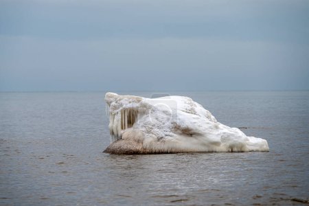 Close-up shot of the snow and ice formation in Baltic sea water on the shore, Kaltene, Latvia