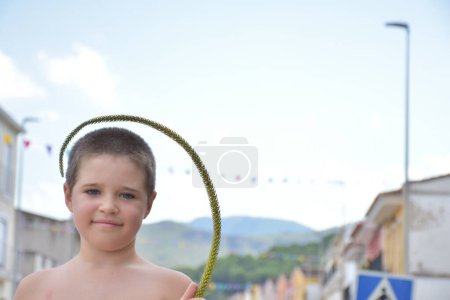 Photo for Cute little boy with rope in the city park - Royalty Free Image