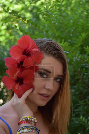 Photo for Portrait of a beautiful young woman with flowers in hair - Royalty Free Image