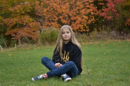 Photo for Young girl with autumn leaves - Royalty Free Image
