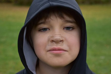 Photo for A young boy in a hood with hood - Royalty Free Image
