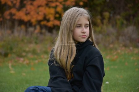 Photo for Portrait of a young girl in a autumn park - Royalty Free Image