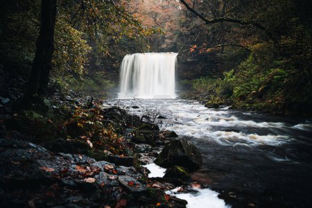 Photo for Sgwd yr Eira waterfall or Fall of Snow along the Four Waterfalls walk, Waterfall Country, Brecon Beacons national park, South Wales, the United Kingdom - Royalty Free Image