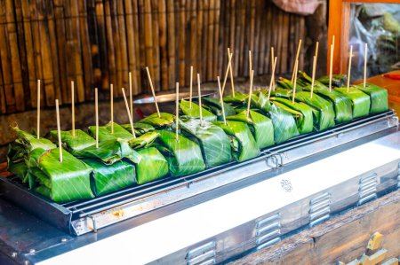 Thai Grilled Egg (Kai Pam) in the banana leaves Cups in Mae Kampong Village, Chiang Mai. Thai Northern Style Food.