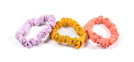 colourful hair scrunchies on white background