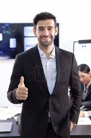 Photo for The chief executive stood for a photo after a meeting to plan the company's business. - Royalty Free Image