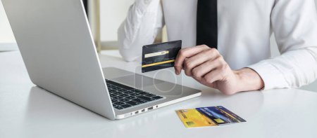 Photo for Man using credit card register security code payments online shopping and customer service network connection market, using technology on laptop, Internet Online shopping or banking concept. - Royalty Free Image