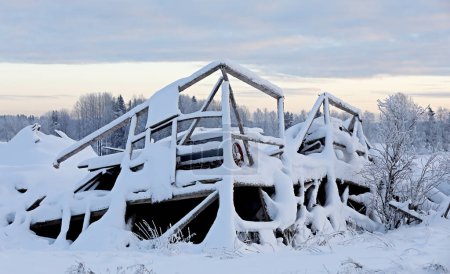 Photo for Fallen old barn in snowy winter landscape - Royalty Free Image
