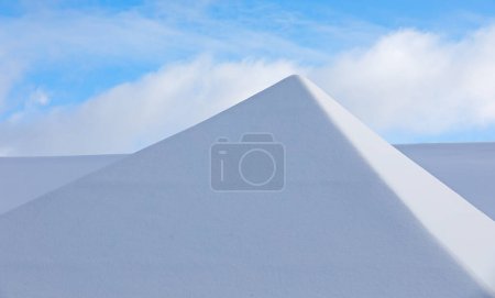 Photo for Snowy roof top against the winter sky - Royalty Free Image
