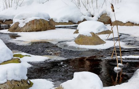 Photo for Snowy stones in small river in winter time - Royalty Free Image