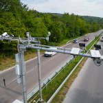 Cameras and speed control radars along a busy highway monitor and record speeding violations. Drone view