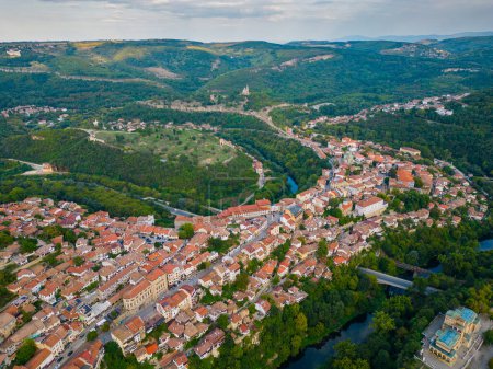 Photo for An aerial view of Veliko Tarnovo reveals a Bulgarian city rich in history and culture, with its beautiful buildings, streets, and picturesque hills. Summer evening. - Royalty Free Image
