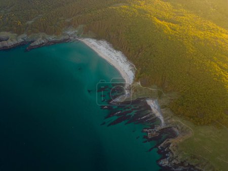 Photo for Aerial view of the rocky, wild coast of the Black Sea in Bulgaria, with cliffs, beaches, and green forests. - Royalty Free Image
