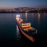 Aerial view cargo bulk carrier ship on the sea at night.