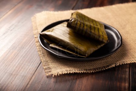 Oaxacan Tamales. Prehispanic dish typical of Mexico and some Latin American countries. Corn dough wrapped in banana leaves. The tamales are steamed. 