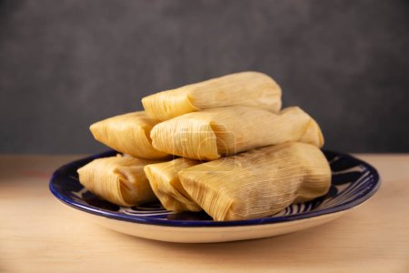 Tamales. Prehispanic dish typical of Mexico and some Latin American countries. Corn dough wrapped in corn leaves. The tamales are steamed. 
