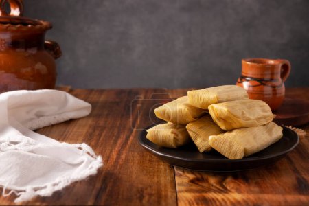 Tamales. Prehispanic dish typical of Mexico and some Latin American countries. Corn dough wrapped in corn leaves. The tamales are steamed.