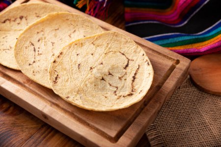 Photo for Corn Tortillas. Food made with nixtamalized corn, a staple food in several American countries, an essential element in many Latin American dishes. - Royalty Free Image