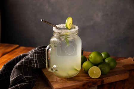 Photo for Homemade lemonade with organic lemons and mint, a popular refreshing drink in many countries. in Mexico it is part of their traditional Aguas Frescas, where it is called Agua de Limon. - Royalty Free Image