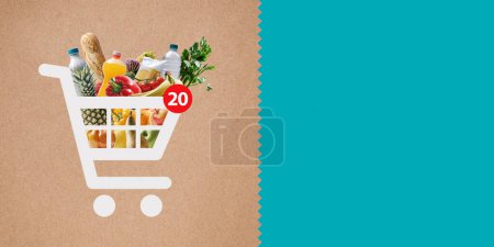 Foto de Aplicación de compras en línea: icono del carrito de compras lleno de comestibles frescos y espacio de copia - Imagen libre de derechos