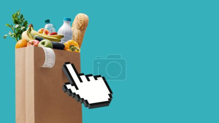 Téléchargez les photos : Curseur à la main en cliquant sur un sac d'épicerie complet, concept d'épicerie en ligne - en image libre de droit