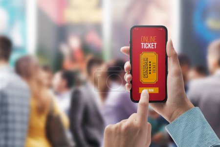 Foto de Woman holding a smartphone and buying movie tickets online using a mobile app, she is skipping the queue, POV shot - Imagen libre de derechos