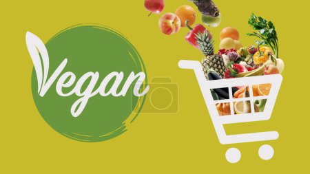 Téléchargez les photos : Vegan food online grocery shopping: shopping cart icon full of vegetables and fruits - en image libre de droit