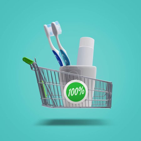 Foto de Cepillos de dientes y pasta de dientes en un carrito de compras volador, accesorios de higiene personal y concepto de compras - Imagen libre de derechos