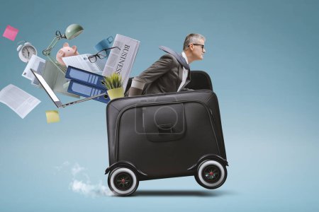 Photo for Businessman riding a fast briefcase with wheels and losing his office equipment, business deadlines concept - Royalty Free Image