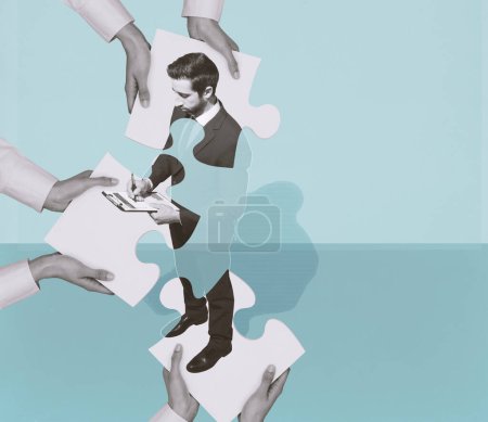 Foto de Hands joining puzzle pieces together and forming a corporate business executive: training of managers and skills concept, copy space - Imagen libre de derechos