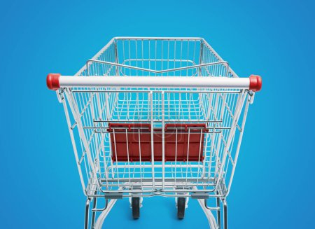 Photo for Empty supermarket shopping cart: grocery shopping and retail concept - Royalty Free Image