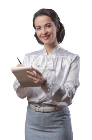 Photo for Attractive vintage secretary taking notes with notepad and pen - Royalty Free Image