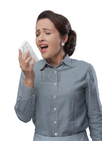Photo for Vintage woman with allergy sneezing on an handkerchief - Royalty Free Image
