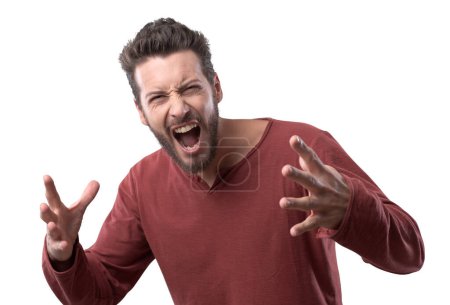 Foto de Hombre agresivo enojado gritando en voz alta con expresión feroz sobre fondo blanco - Imagen libre de derechos