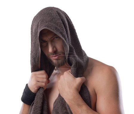 Photo for Sexy man covering his head with a towel and looking at camera  on white  background - Royalty Free Image