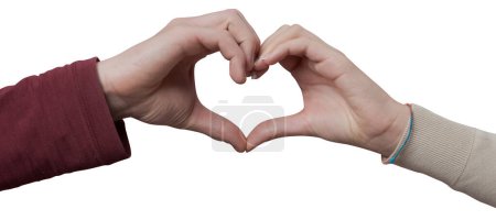 Téléchargez les photos : Jeune couple romantique composant une forme de coeur avec les mains - en image libre de droit