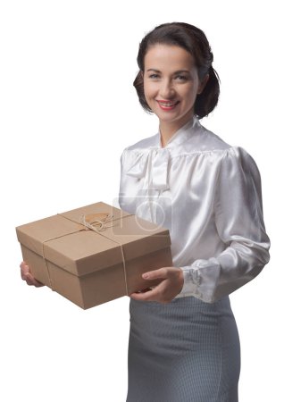 Photo for Smiling vintage woman holding a mail parcel package, shipping and delivery concept - Royalty Free Image